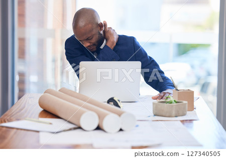 Black man, business and neck pain in office, stress and overworked with laptop, documents and tired. Young man, Jamaican entrepreneur and architect with shoulder strain, burnout or frustrated at desk Black man, business and neck pain in office, stress and overworked with laptop, documents and tired. Young man, Jamaican entrepreneur and architect with shoulder strain, burnout or frustrated at desk 127340505
