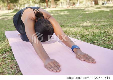 Black woman, stretching or nature park yoga on mat in for zen healthcare wellness, relax exercise or workout peace training. Childs pose, fitness yogi or person on garden grass in back muscle pilates Black woman, stretching or nature park yoga on mat in for zen healthcare wellness, relax exercise or workout peace training. Childs pose, fitness yogi or person on garden grass in back muscle pilates 127340513