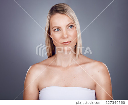 Skincare, beauty and face of woman in studio for wellness, body care and beauty products on gray background. Dermatology, luxury spa and girl marketing facial treatment, healthy skin and cosmetics Skincare, beauty and face of woman in studio for wellness, body care and beauty products on gray background. Dermatology, luxury spa and girl marketing facial treatment, healthy skin and cosmetics 127340560