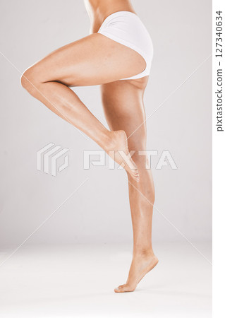 Skincare, legs glow and woman in underwear for body wellness, cosmetic lifestyle and dermatology healthcare on a studio background. Cellulite, beauty and feet of a natural model for cosmetology 127340634
