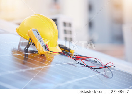 Tools, solar panels or helmet on roof for solar energy installation in a city development project. Voltmeter, Construction, renewable energy or electric engineering equipment for building maintenance 127340637