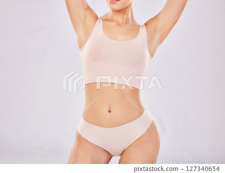 Diet, health and woman in underwear, skincare and weight loss on studio background. Female, girl and body care for wellness, healthy lifestyle and cosmetics beauty for natural care, fitness or bikini 127340654