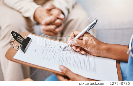 Nurse, clipboard and pen for checklist with patient, healthcare service and medical information. Closeup doctor hands writing documents, research and questions for report, planning and wellness admin 127340780