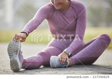Woman, exercise and fitness while stretching outdoor at a city park for health and wellness with cardio training. Athlete female sitting for warm up workout and running for healthy lifestyle and body Woman, exercise and fitness while stretching outdoor at a city park for health and wellness with cardio training. Athlete female sitting for warm up workout and running for healthy lifestyle and body 127340829