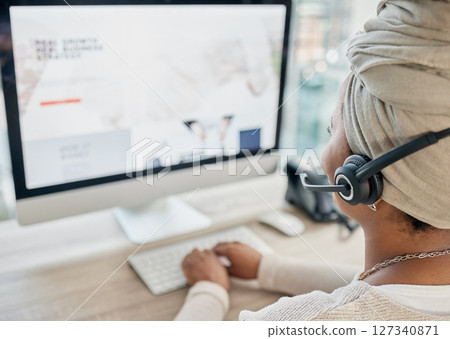Black woman, call center and computer with CRM and contact us, phone call with customer service or telemarketing. Tech support, technology and office with communication and contact center employee. 127340871
