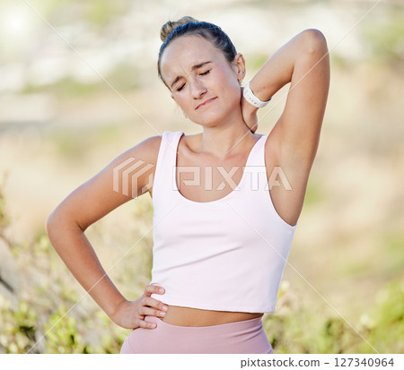 Woman, neck pain or muscle stress in fitness, workout or training in nature park, countryside environment or public garden. Runner, sports athlete or injured personal trainer with body injury crisis 127340964