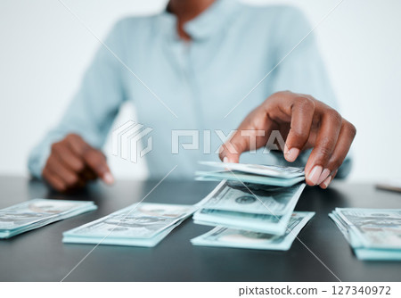 Hands, money and desk for saving, planning or budget in finance office with african financial advisor. Cash, investment and future wealth with dollar, bills and savings with financial coaching advice 127340972