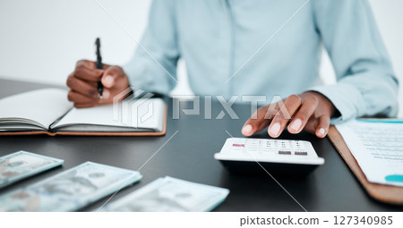Hand, calculator and writing with a finance accountant working on savings or investment in a work office. Money, accounting and budget with a bank employee at work for financial growth or planning Hand, calculator and writing with a finance accountant working on savings or investment in a work office. Money, accounting and budget with a bank employee at work for financial growth or planning 127340985