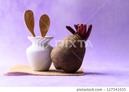 Fresh beetroot on purple background, Imperfectly shape 127341035