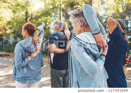 Fitness, nature and senior people doing stretching exercise before cardio training in a park. Health, wellness and active group of elderly friends in retirement doing arm warm up for outdoor workout. Fitness, nature and senior people doing stretching exercise before cardio training in a park. Health, wellness and active group of elderly friends in retirement doing arm warm up for outdoor workout. 127341044