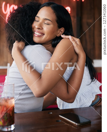 Happy, support and friends hug at restaurant for bond, care and reunion hangout in Chicago, USA. Happiness, smile and embrace of black people in friendship enjoying friendly greeting at diner. 127341060