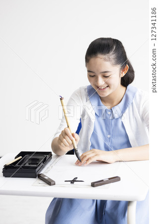 Children doing calligraphy Children doing calligraphy 127341186