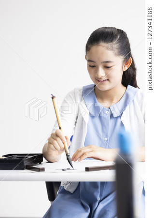 Children doing calligraphy Children doing calligraphy 127341188
