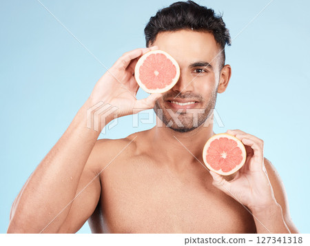 Beauty, health and portrait of man with grapefruit for fruit detox, healthy body or natural facial skincare routine. Wellness spa salon, vitamin c glow and happy nutritionist model with food product Beauty, health and portrait of man with grapefruit for fruit detox, healthy body or natural facial skincare routine. Wellness spa salon, vitamin c glow and happy nutritionist model with food product 127341318