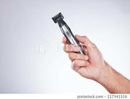 Hand, razor and hair removal with beauty and man with grooming mockup, hygiene and body hair care against studio background. Shaving, electric shaver and cosmetic tools product with face care Hand, razor and hair removal with beauty and man with grooming mockup, hygiene and body hair care against studio background. Shaving, electric shaver and cosmetic tools product with face care 127341319