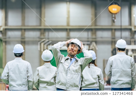 A worker leader is shocked in a factory 127341468