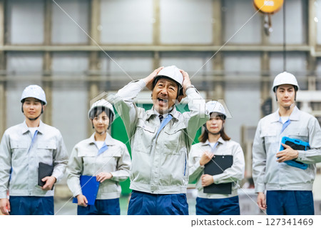 A worker leader is shocked in a factory 127341469