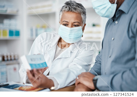 Covid, pharmacy and woman with box consulting patient on prescription, medication or medicine. Corona, healthcare and senior female medical professional showing black man health product in drug store Covid, pharmacy and woman with box consulting patient on prescription, medication or medicine. Corona, healthcare and senior female medical professional showing black man health product in drug store 127341524