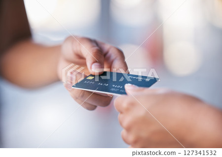 Hands, credit card and payment with a woman customer and clerk transaction in a mall or store while shopping. Money, finance and retail with a female consumer paying for a purchase on deal or sale Hands, credit card and payment with a woman customer and clerk transaction in a mall or store while shopping. Money, finance and retail with a female consumer paying for a purchase on deal or sale 127341532