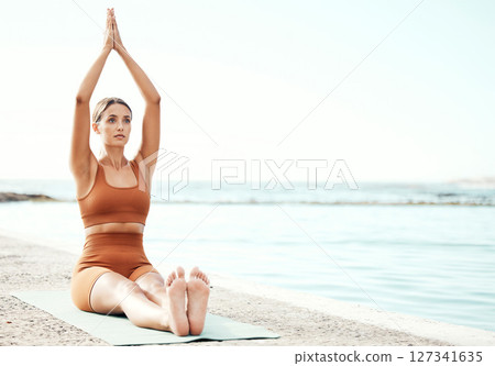 Fitness, yoga and zen, woman at beach stretching for meditation and training in nature for healthy lifestyle. Health, wellness and workout for girl at ocean, pilates exercise for balance at sea water 127341635