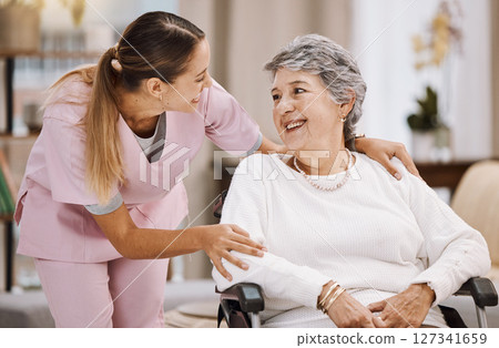 Healthcare, support and caregiver with senior woman for medical help, elderly care and consulting patient. Wheelchair disability, rehabilitation and nurse volunteer at nursing home for charity work 127341659