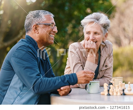Happy, chess or couple of friends in nature playing a board game, bonding or talking about a funny story. Park, support or healthy senior people laughing at a joke and enjoying quality relaxing time Happy, chess or couple of friends in nature playing a board game, bonding or talking about a funny story. Park, support or healthy senior people laughing at a joke and enjoying quality relaxing time 127341815