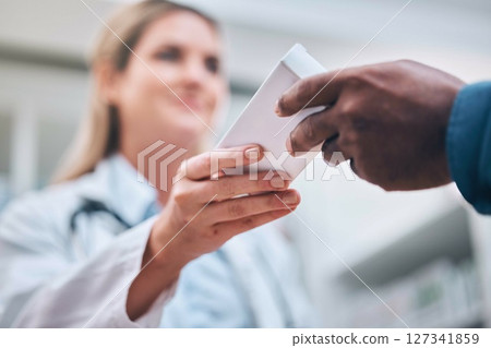 Pharmacy, medication box and pharmacist helping a patient with medical prescription at clinic. Medicine, healthcare and guy getting pills, cure or treatment at a pharmaceutical drug store or chemist. 127341859