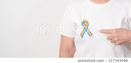 Elderly with LGBTQ Rainbow ribbon for concept of June Pride month, April Autism Awareness, All cancer Awareness, February World Cancer day, October World Hospice and Palliative care day and Survivor Elderly with LGBTQ Rainbow ribbon for concept of June Pride month, April Autism Awareness, All cancer Awareness, February World Cancer day, October World Hospice and Palliative care day and Survivor 127343496