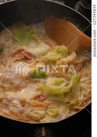 Cream pasta being cooked Cream pasta being cooked 127343934