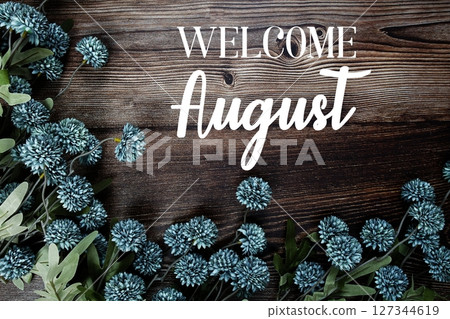 Welcome August text with flowers bouquet decoration on wooden background 127344619