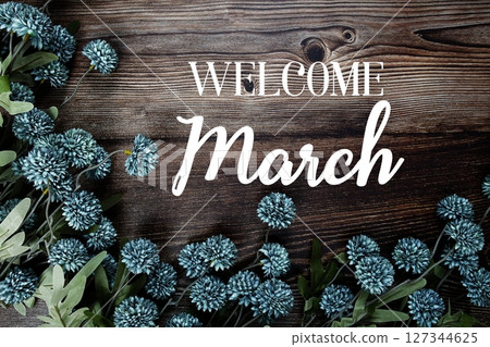 Welcome March text with flowers bouquet decoration on wooden background 127344625