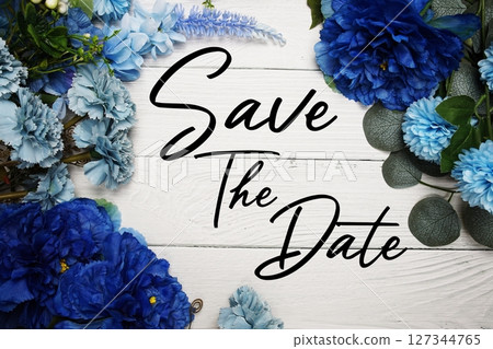 Save The Date text with blue flowers bouquet decoration on wooden background Save The Date text with blue flowers bouquet decoration on wooden background 127344765