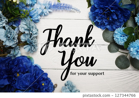 Thank You text with blue flowers bouquet decoration on wooden background Thank You text with blue flowers bouquet decoration on wooden background 127344766