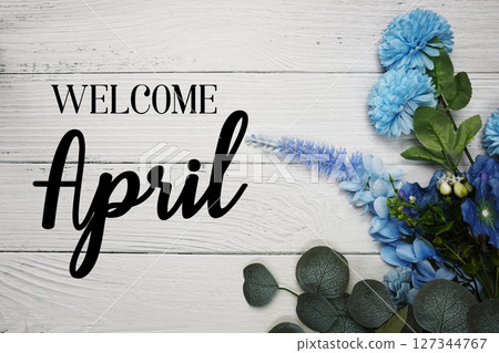 Welcome April text with blue flowers bouquet decoration on wooden background Welcome April text with blue flowers bouquet decoration on wooden background 127344767