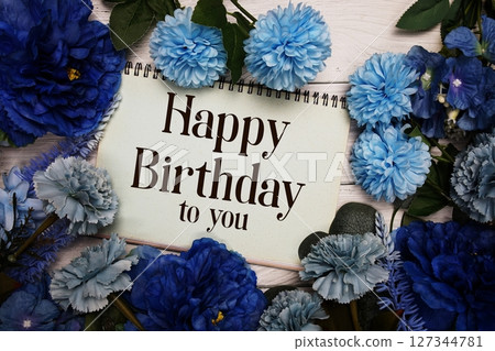 Happy Birthday to you text with blue flowers bouquet decoration on wooden background Happy Birthday to you text with blue flowers bouquet decoration on wooden background 127344781
