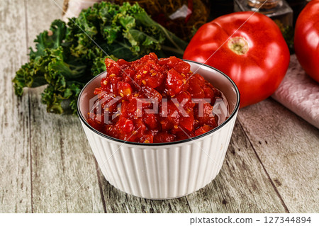 Diced ripe tomato with sauce 127344894