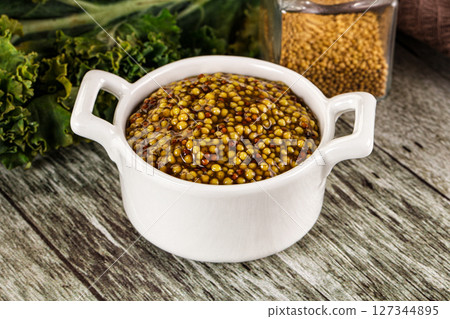Mustard sauce with seeds in the bowl 127344895