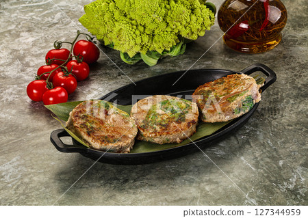 Roasted tuna medallion with broccoli Roasted tuna medallion with broccoli 127344959