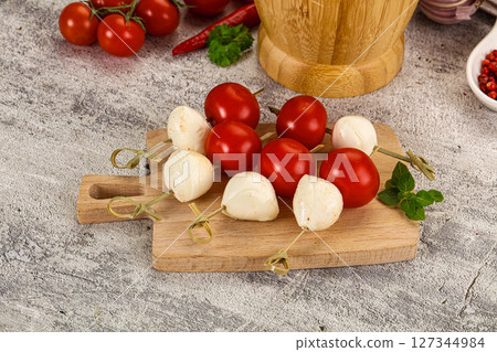 Mozzarella with cherry tomato canape Mozzarella with cherry tomato canape 127344984