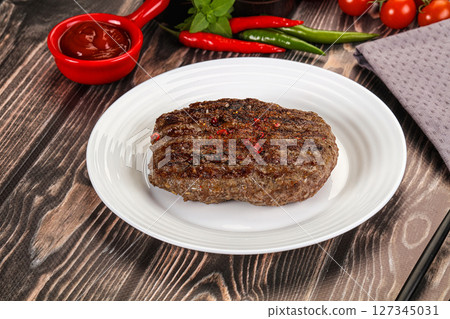 Grilled beef burger cutlet with sauce Grilled beef burger cutlet with sauce 127345031