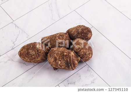 Brown topinambur roots for cooking Brown topinambur roots for cooking 127345110