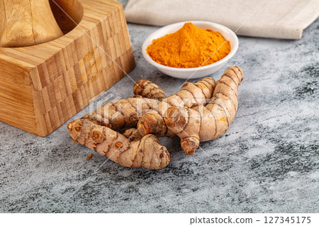 Fresh aroma tumeric roots heap Fresh aroma tumeric roots heap 127345175