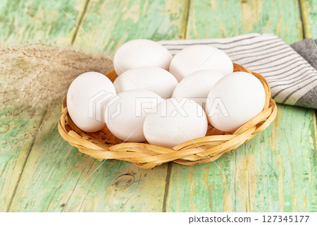 Raw white uncooked chicken eggs Raw white uncooked chicken eggs 127345177