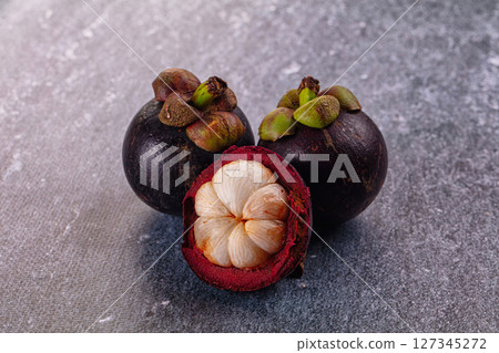Ripe sweet juicy tropical mangosteen Ripe sweet juicy tropical mangosteen 127345272