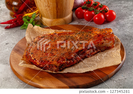 Raw marinated pork loin steak 127345281