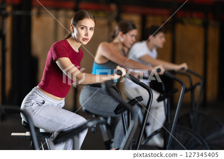 Woman training on an airbike 127345405
