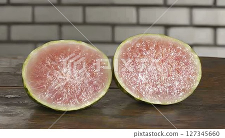 Sliced watermelon radish halves reveal a vibrant pink interior o 127345660