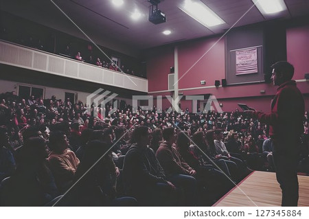 Engaging Presentation Delivering Knowledge to Eager Audience in Auditorium Engaging Presentation Delivering Knowledge to Eager Audience in Auditorium 127345884