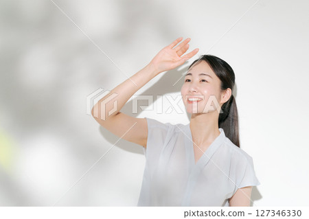 A woman who cares about UV rays A woman who cares about UV rays 127346330