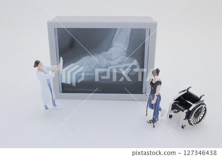 Mini Doctors Analyzing Medical X Rays in Clinical Setting Mini Doctors Analyzing Medical X Rays in Clinical Setting 127346438